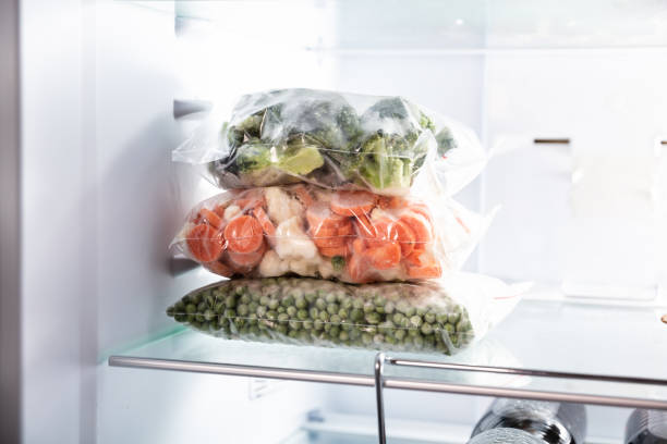 istock Plastic Bags With Frozen Vegetables In Refrigerator 1322052082
