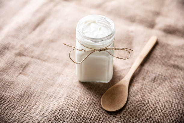 istock Yogurt In Jar Near Wooden Spoon 1322052084