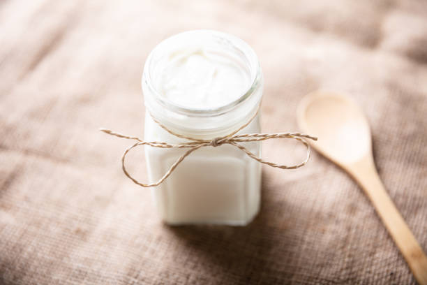 istock Yogurt In Jar Near Wooden Spoon 1322052085