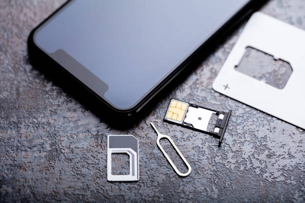 istock Nano Sim Card In The Card Adapter With Eject Pin 1322052131
