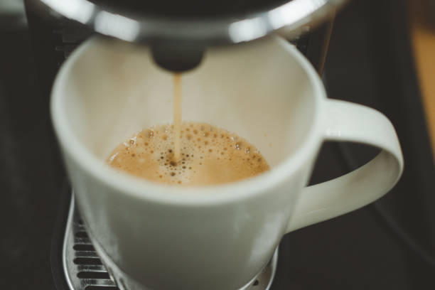 istock Pouring coffee machine for making espresso at home pouring out coffee 1322052139