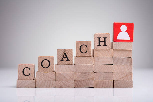 istock Red Human Figure Block Next To Word Life Coach 1322052162