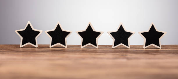 istock Five Star Rating Icon On Desk 1322052241