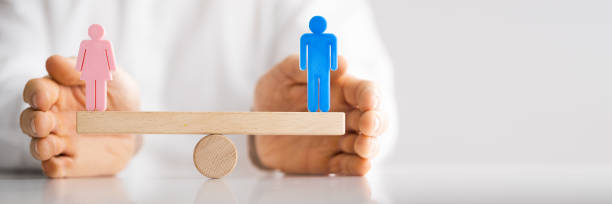 istock Equal Gender Seesaw Balance 1322052354