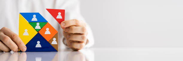 istock HR Recruitment Hand Making Tangram Puzzle 1322052386