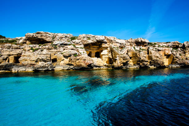 2021 05 30 Favigniana ancient tuff quarries old abandoned tuff quarries on the coast with crystal clear blue sea in the island of Favignana in Trapani Sicily Italy egadi islands photos stock pictures, royalty-free photos & images