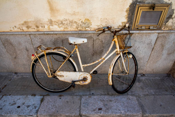 old rusty white woman's bike in Favignana island in Trapani Sicily Italy