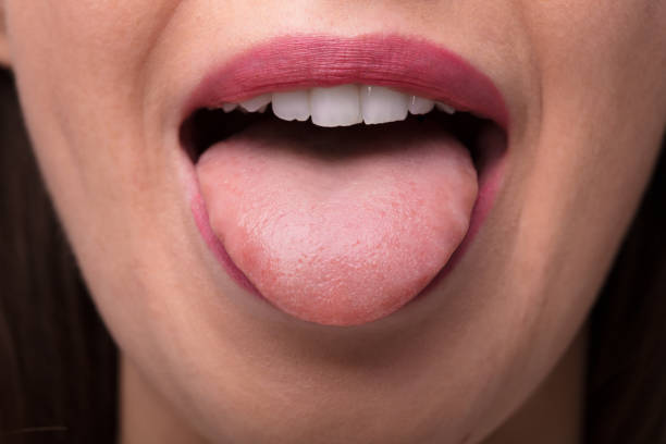 istock Woman Showing Tongue 1322055051