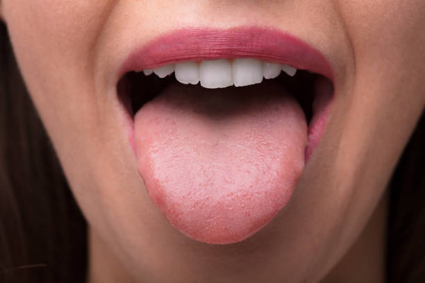 istock Woman Showing Tongue 1322055054