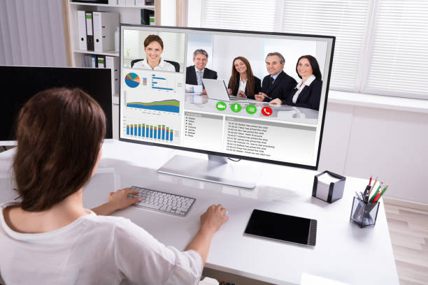 istock Businesswoman Video Conferencing With Colleagues On Computer 1322055125