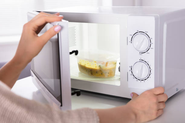 istock Woman Preparing Food In Oven 1322055703