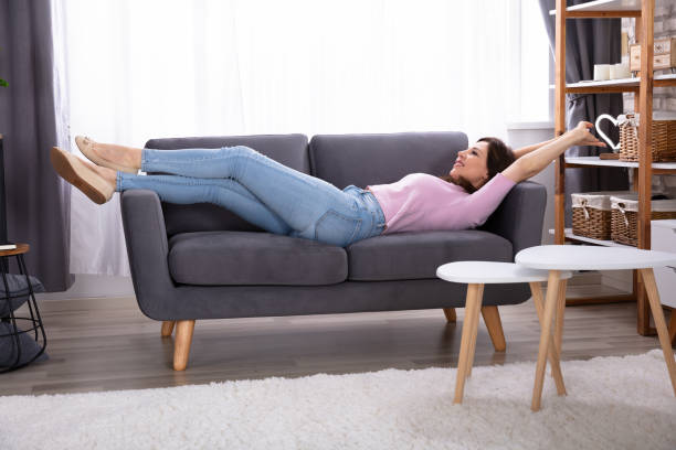 istock Young Woman Lying On Sofa 1322055884