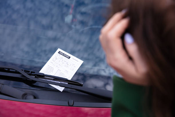 istock Car With Ticket Fine For Parking Violation 1322056325
