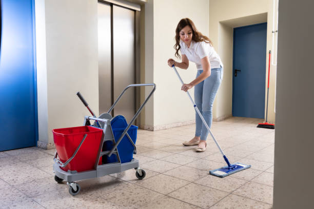 istock Janitor Cleaning Floor In Corridor 1322056361