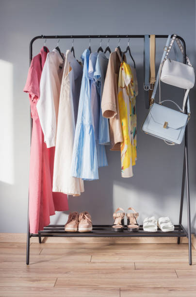 istock light colored womens summer clothes and shoes on  hanger 1322059220