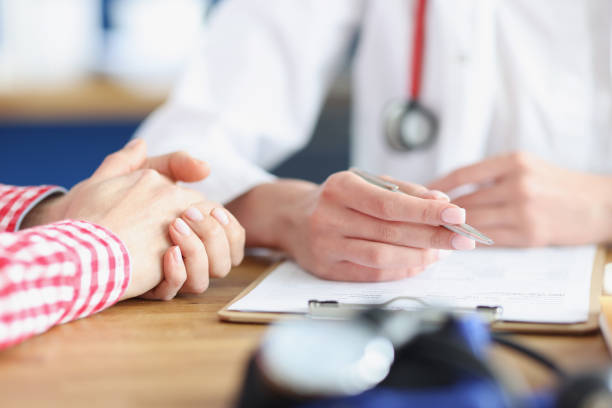 istock Doctor sees patient and writes down medical indicators on card 1322071987
