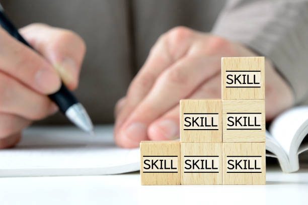 Skills up concepts, piled wooden blocks with skill word and studying person Skills up concepts, piled wooden blocks with skill word and studying person nontraditional student photos stock pictures, royalty-free photos & images