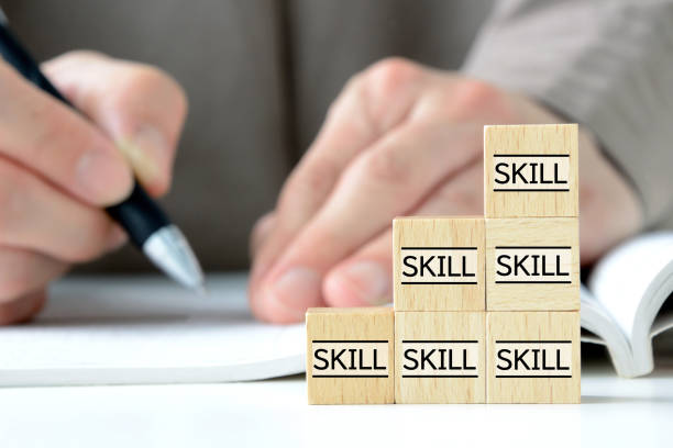 Skills up concepts, piled wooden blocks with skill word and studying person Skills up concepts, piled wooden blocks with skill word and studying person mature student stock pictures, royalty-free photos & images