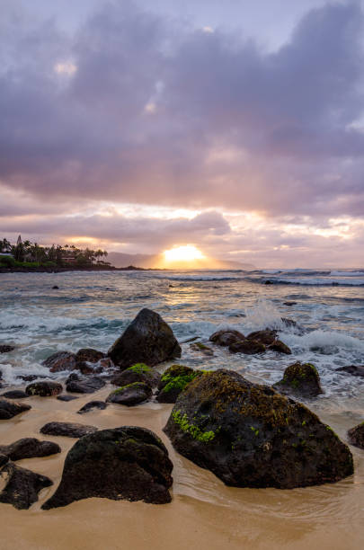 istock Sunset over waves at Upper's Beach Park, Oahu, Hawaii 1322072698
