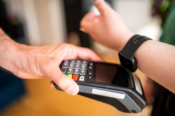 istock Woman paying bill with smartwatch 1322073779