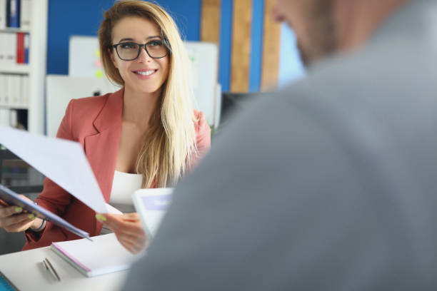istock Young woman checking company financial documents closeup 1322073948