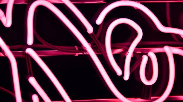 istock Glowing fragment of a neon sign, close-up, abstract background 1322076708