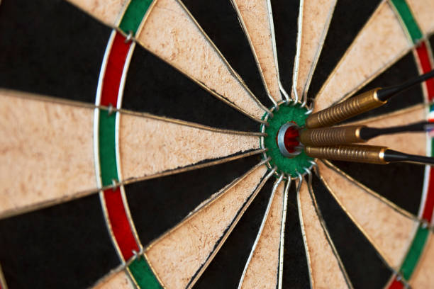 istock Dart arrow hit bullseye, close-up 1322080352