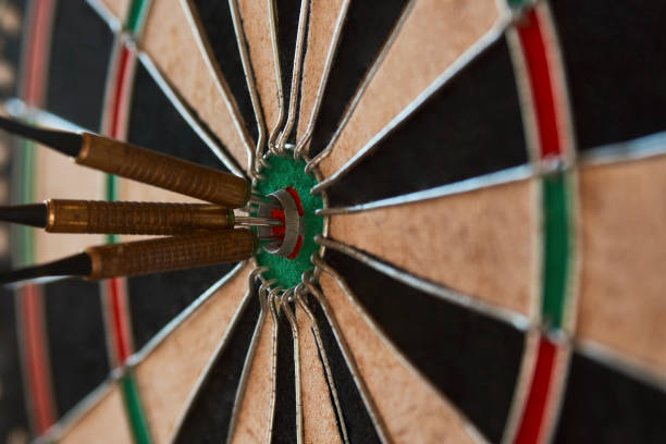 istock Dart arrow hit bullseye, close-up 1322080354