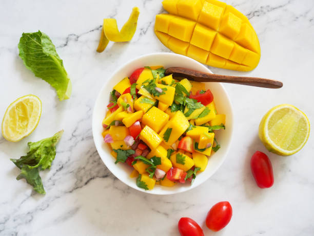 Mango salsa salad bowl in top view.