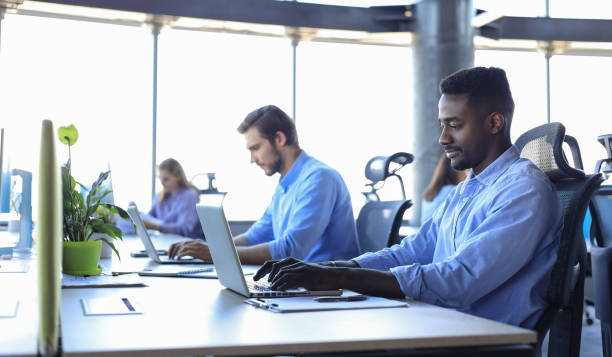 istock Modern business men analyzing stock market data while working in the office. 1322086796
