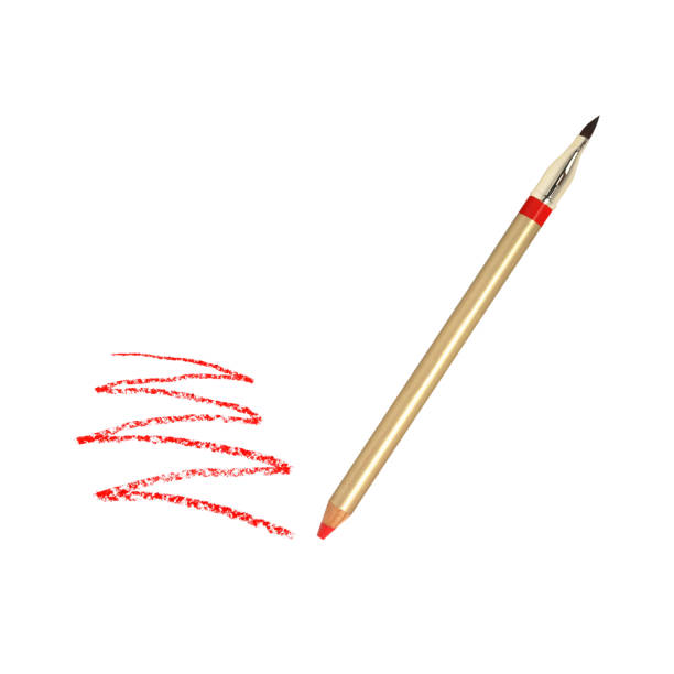 istock Golden lip pencil with red trace isolated on white 1322090437