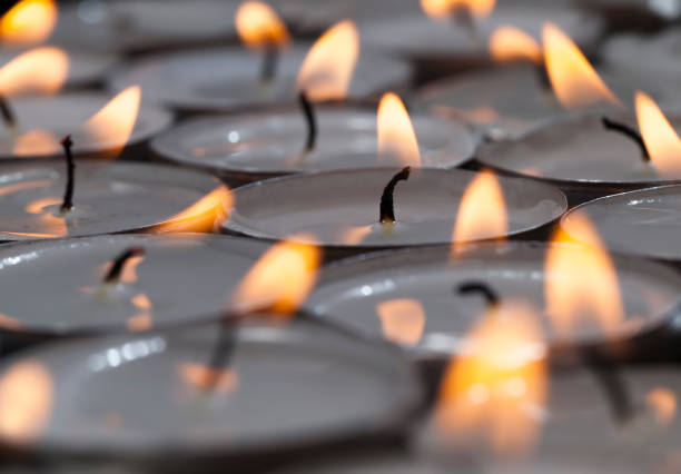 istock a large number of small candles burning together 1322092415