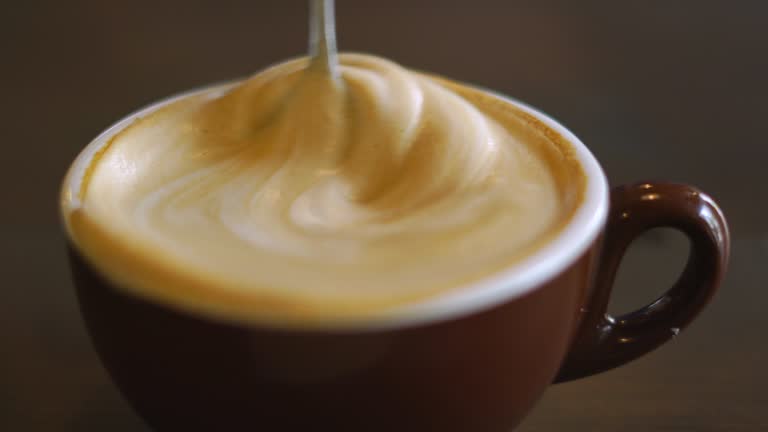 Stirring Cappuccino With Spoon