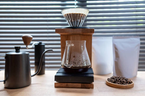 istock Hand drip coffee, Barista making drip coffee with mockup blank package coffee Alternative ways of brewing Coffee shop concept. 1322093863