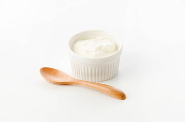 Fresh greek yogurt in Ceramic white Ramequin on white background