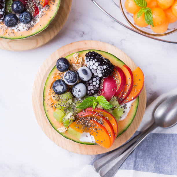 istock Fruit salad with yogurt in carved melon cantaloupe bowl 1322097121