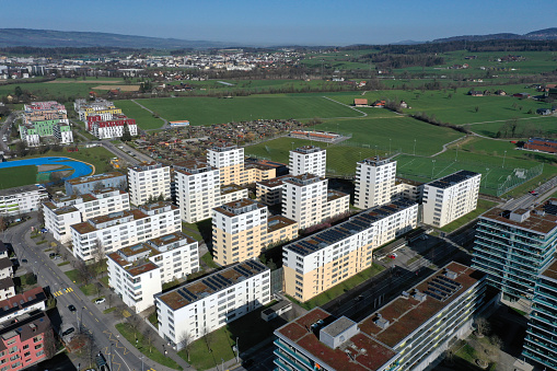 Zug the small town in central switzerland with arround 30'000 residents captured during a beautiful day in springtime. The image shows the modern part of the city with several residential buildings.