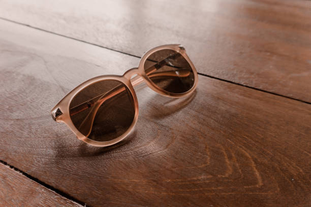 istock Brown glasses on a wooden table 1322098468