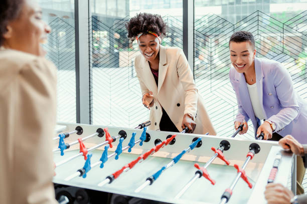 istock Business Colleagues Playing Table Football 1322098480