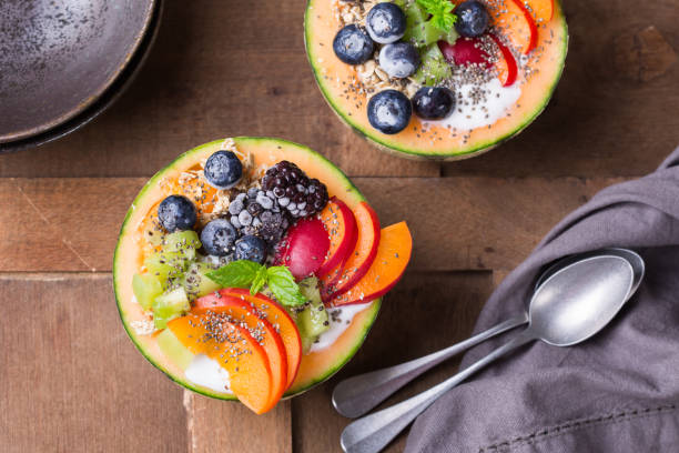 istock Fruit salad with yogurt in carved melon cantaloupe bowl 1322099439