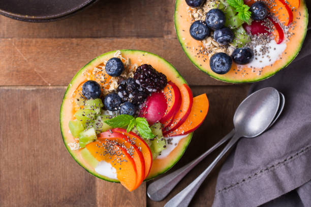 istock Fruit salad with yogurt in carved melon cantaloupe bowl 1322101014