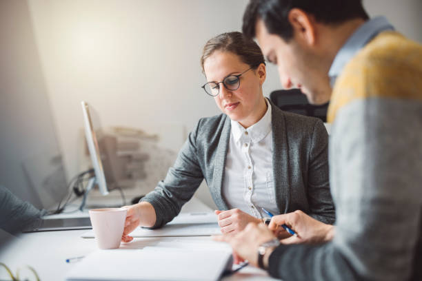 istock Colleagues at law firm working on a case together 1322103500