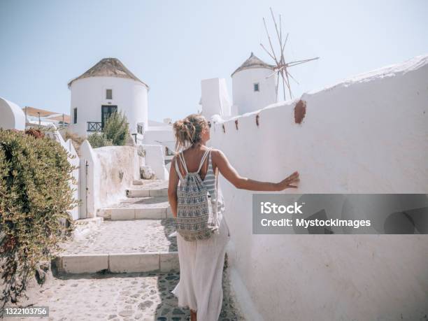 Woman Contemplates The Streets Of Santorini Greece Stock Photo - Download Image Now