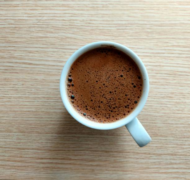istock cup of coffee on wooden table 1322106048