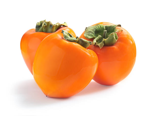 istock Three ripe juicy sweet persimmons isolated on white 1322106453