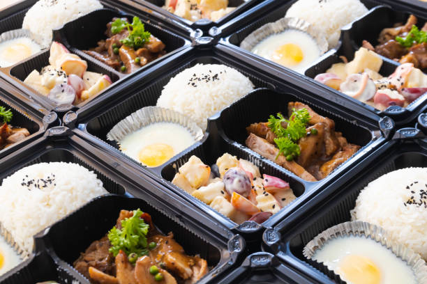 istock Modern Thai food lunch boxes in plastic packages. Thai rice with pork steak. 1322106595