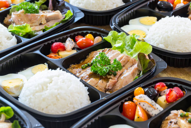 istock Modern Thai food lunch boxes in plastic packages. Thai rice with pork steak. 1322106609