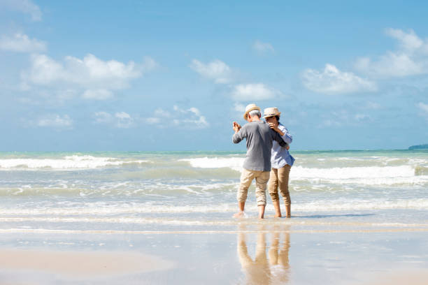 istock asian senior couple  dancing  on the  beach 1322107323