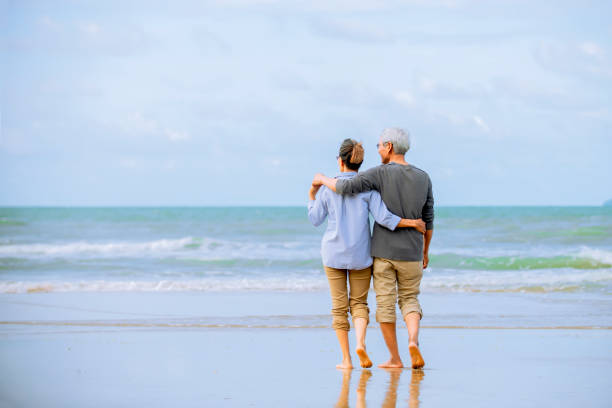 istock asian senior couple  on beach 1322107345