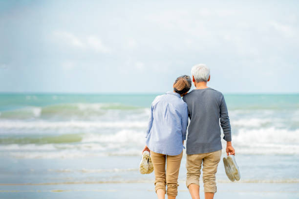 istock asian senior couple  on beach 1322107923